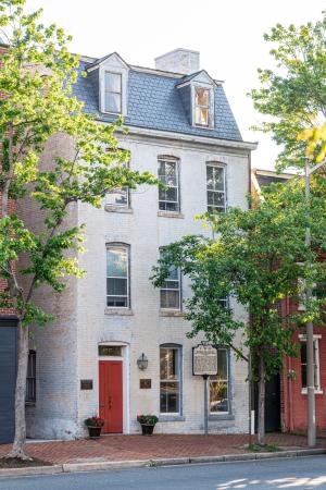 Freedom House, early 2025, grey with mansard roof.