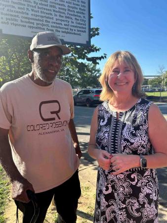 Stanley Greene and Gretchen Bulova stand in front of the Colored Rosemont state historic marker. Mr. Greene wears a Colored Rosemont t-shirt.