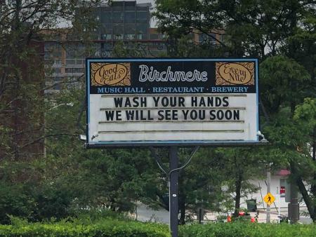 The Birchmere Music Hall’s billboard reads, “Wash your hands. We will see you soon.”