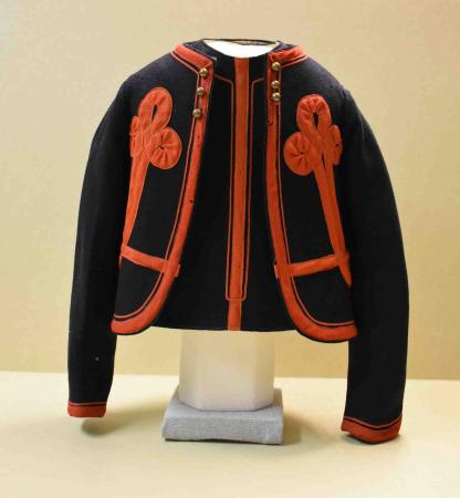 A child’s jacket in dark blue with elaborate red braid imitates the Zouave uniform.
