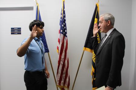 ASO Cadet Regalado stands with Court Clerk Greg Parks during swearing in ceremony
