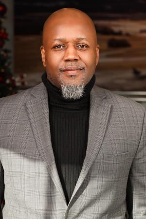 man in grey blazer and black shirt 