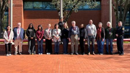 Community Academy Graduates Pose for a Group Photo Outside of the Adult Detention Center Facility