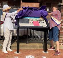 Gayle Converse and Pat Miller, Alexandria Celebrates Women, unveil the marker