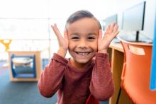 Little Boy Playing Peekaboo