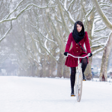 woman riding bike in snow