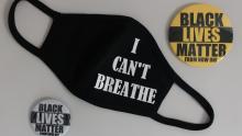 black face mask that says "I can't breathe" and two pins that say Black Lives Matter