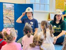 PreK students take part in a storytime portion of the Science Underground outreach lesson.