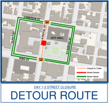 Map showing a detour route around a street closure near City Hall, bordered by Cameron St, North Fairfax St, and King St. The closed area is marked in red, while the detour route is highlighted in green.