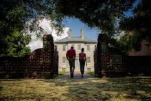 two people standing in front of Carlyle house