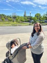 Jeanine with her daughter outdoors with the Masonic Temple in the background 