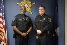 Lt. Bryant standing with Sheriff Casey after being promoted