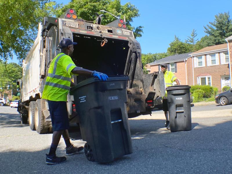 City crews collecting trash carts