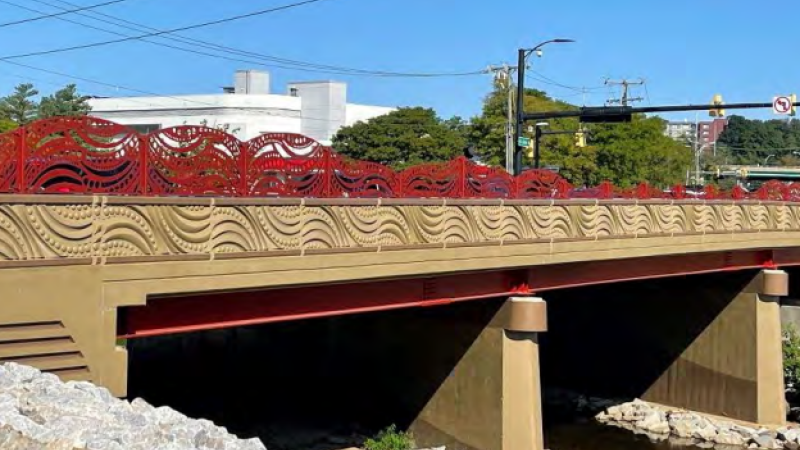 Photo of the completed W Glebe Road bridge, showing off the new red metal decorative railing.
